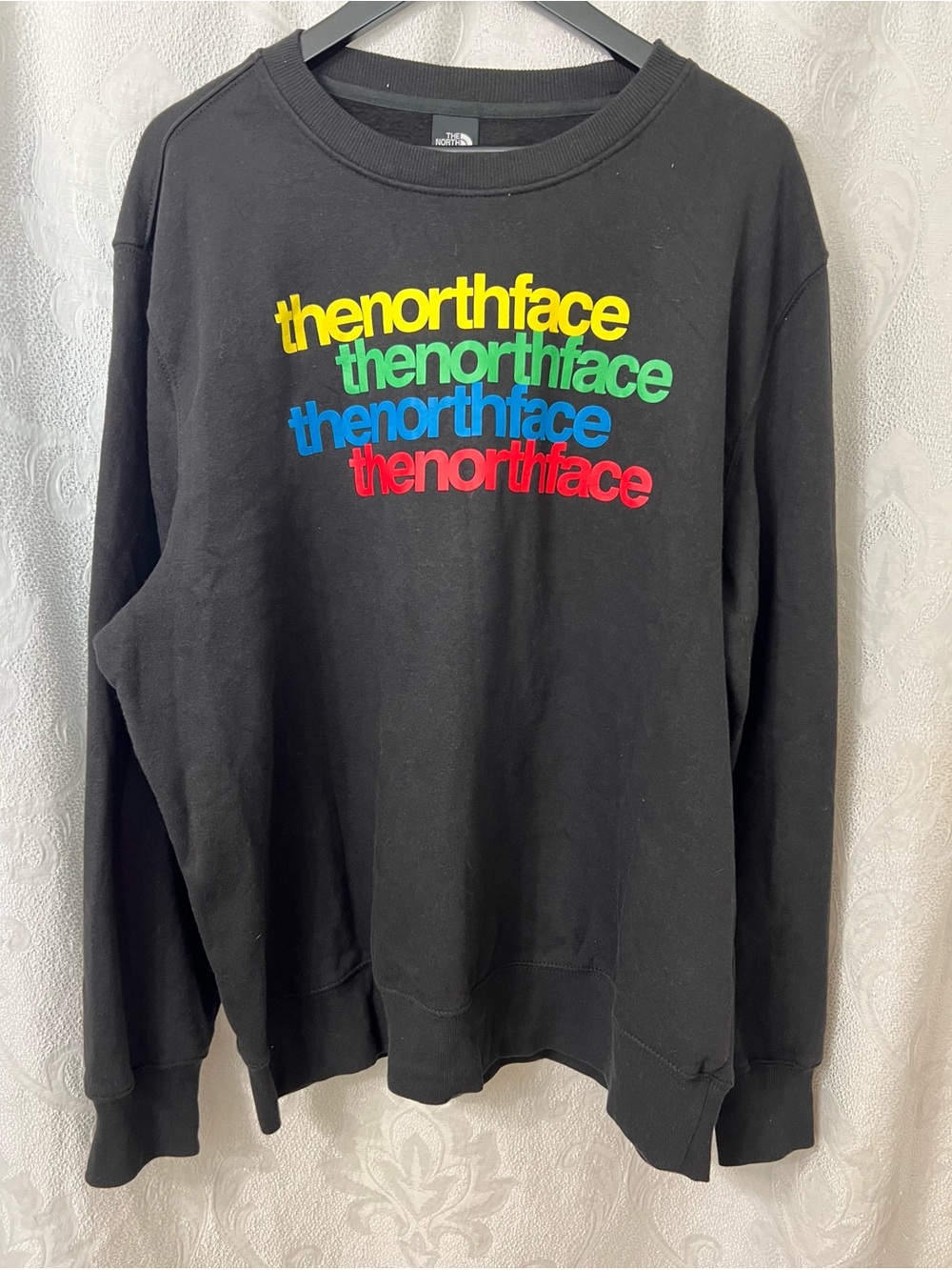 The North Face Me's Black Sweatshirt with Multicolor Stacked Logo size XXL.